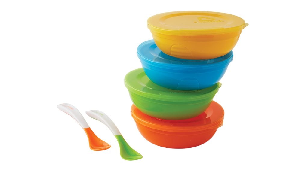 Four colourful Munchkin bowls with spoons.