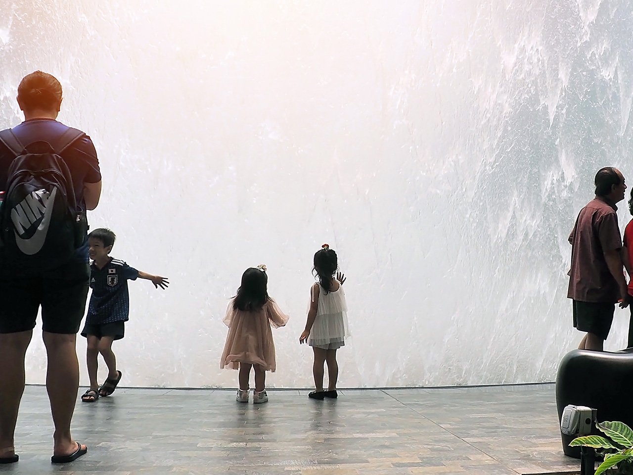 kids touching a fountain at Singapore's Changi busiest airport
