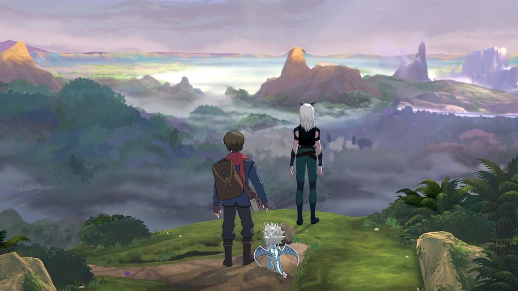 two explorers and a baby dragon overlook a foggy valley landscape