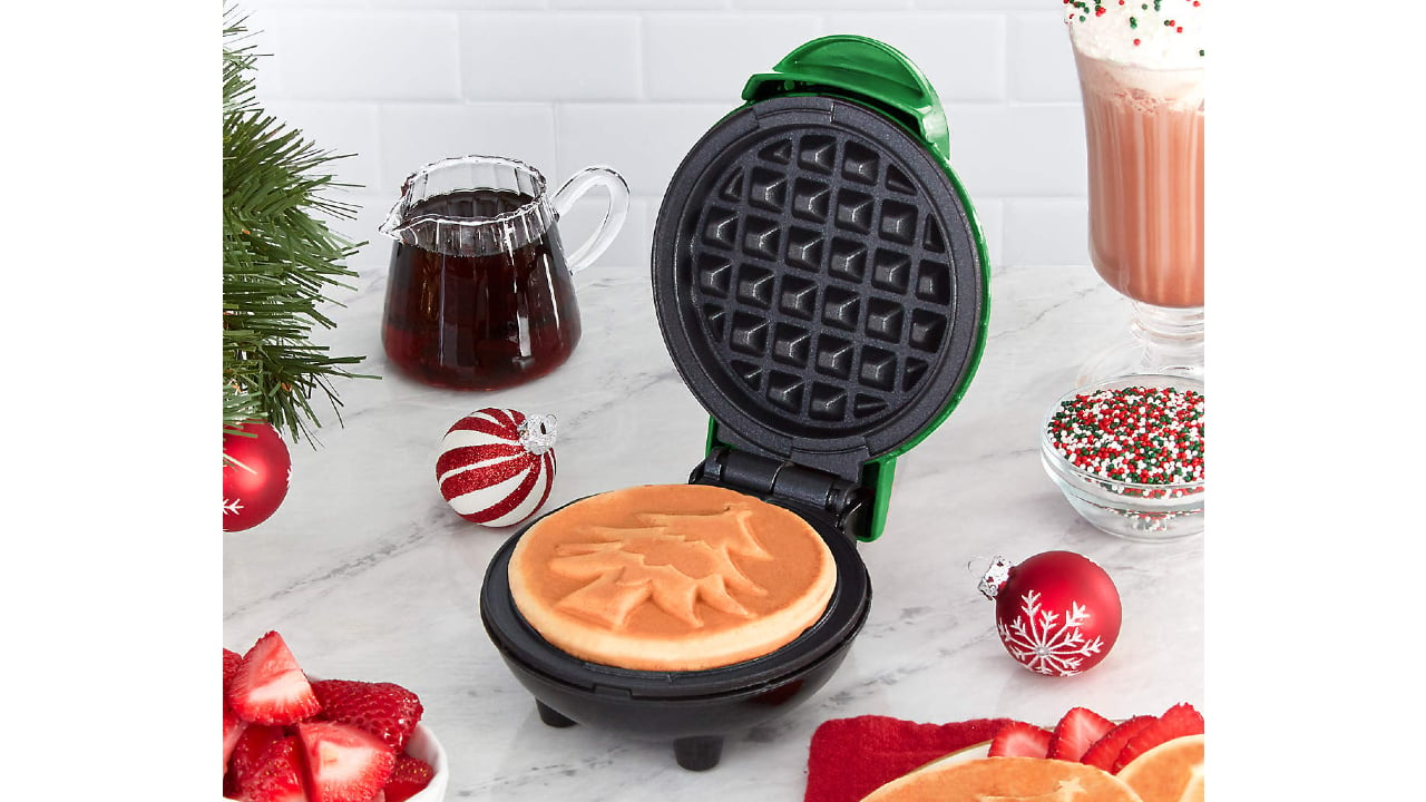 green mini waffle maker with Christmas tree design