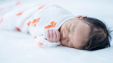 Cord blood banking: Swaddled newborn sleeping