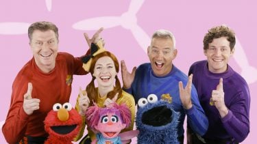 The Wiggles posing with Elmo and friends from Sesame Street