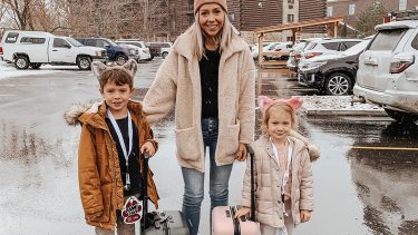 Winter getaway: Britt Havens and her two children stand in the Great Wolf Lodge parking lot