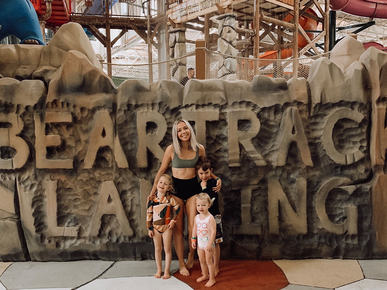 Winter getaway: Havens and her two kids plus friend Natalie Young's child pose outside the lodge water park in swimsuits