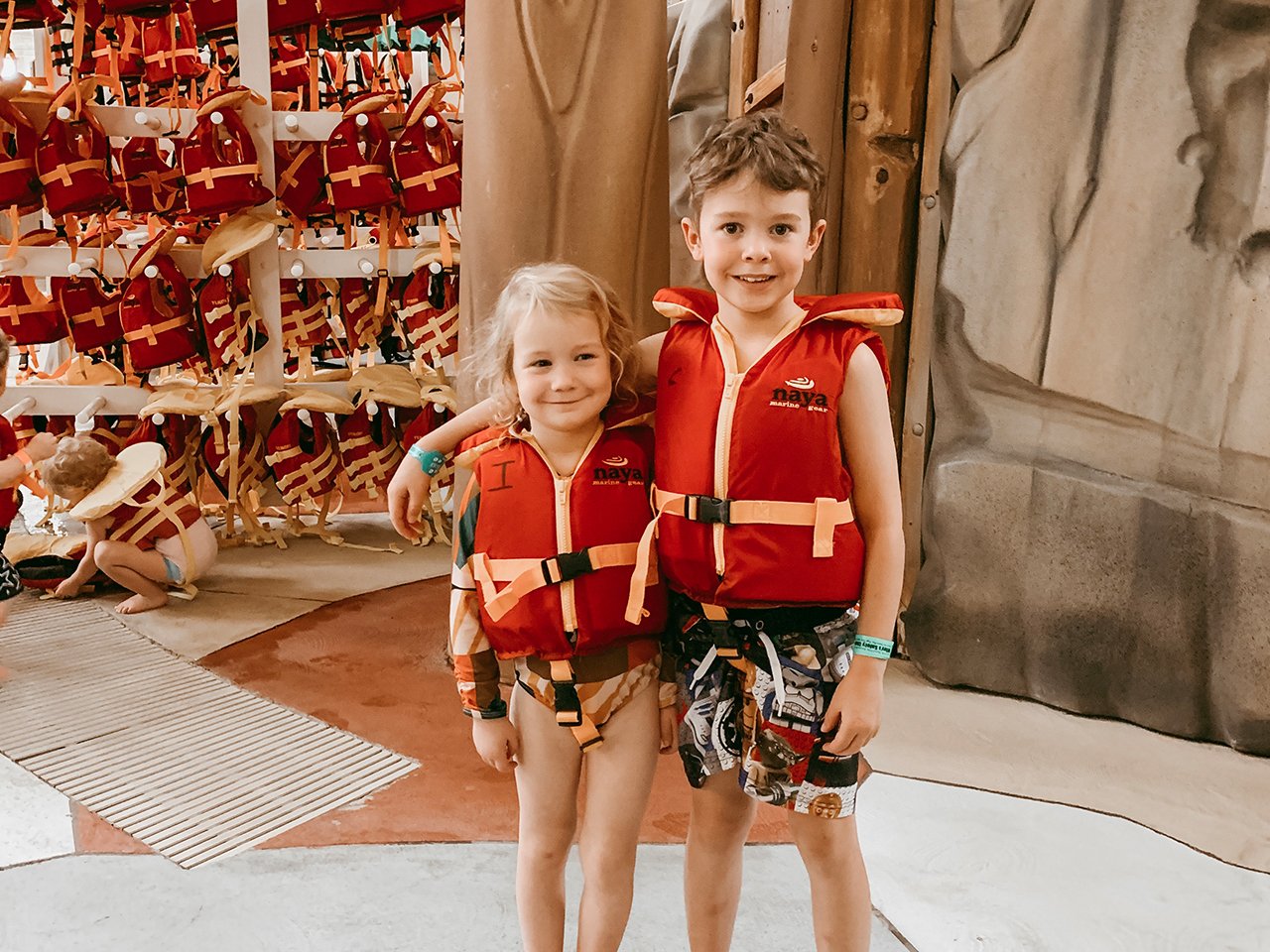 Winter getaway: Haven's two kids stand inside the water park wearing life jackets