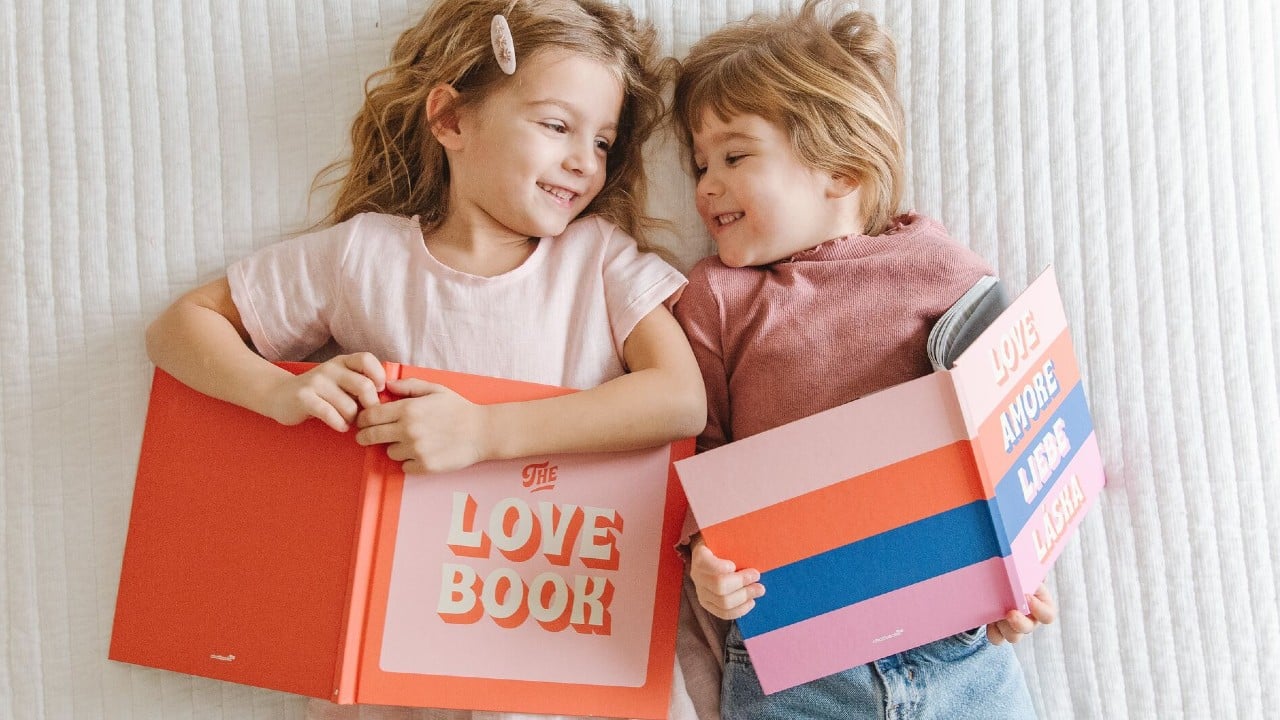 kids laying on the floor with Valentine's Day themed books