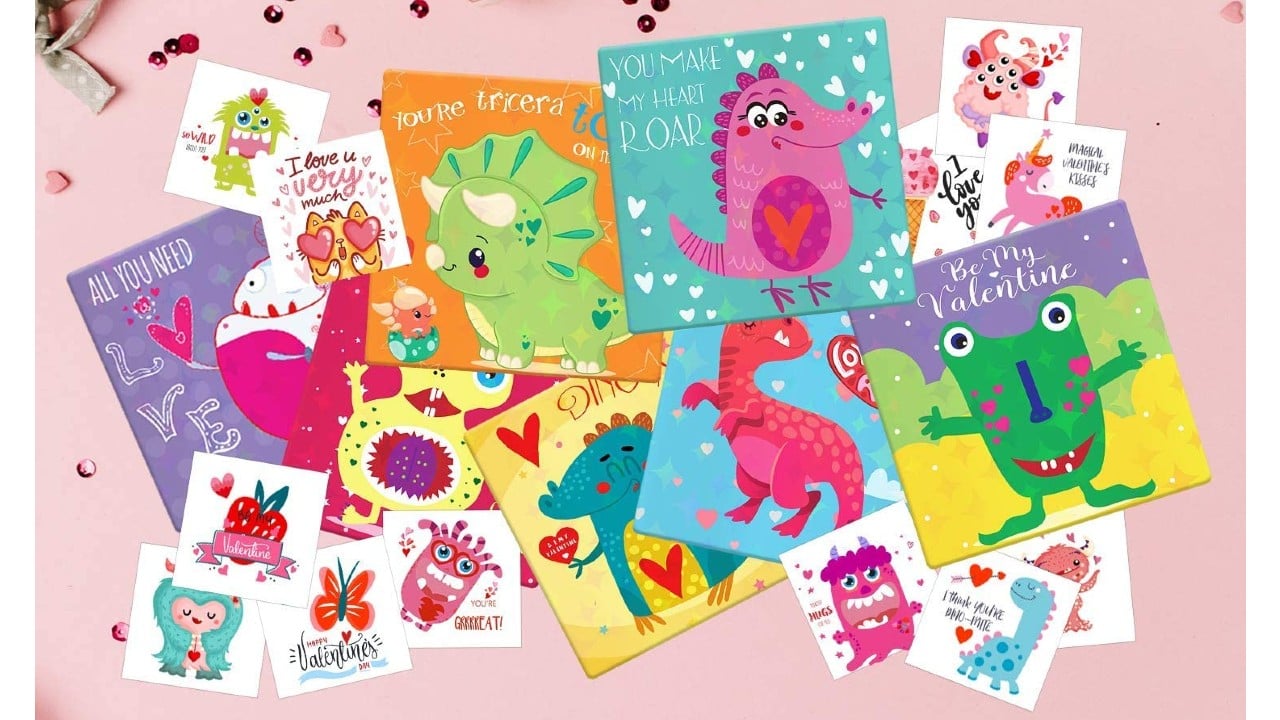 dinosaur valentine's day cards and temporary tattoos laid out on decorated table