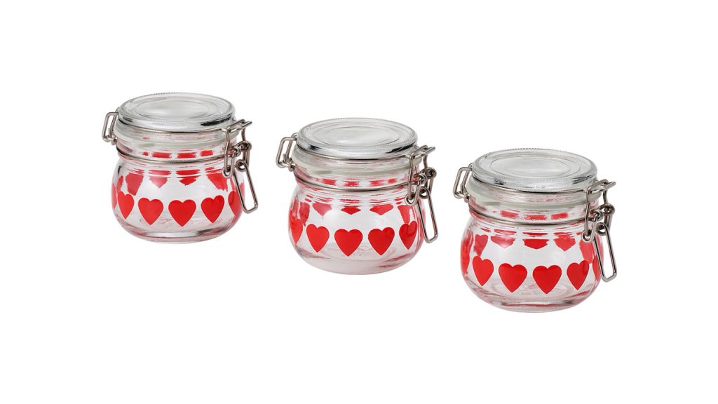 three glass jars with hearts