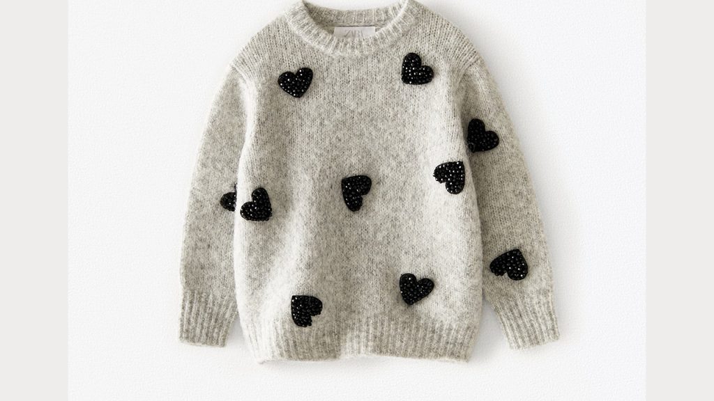 sweater with embroidered black hearts