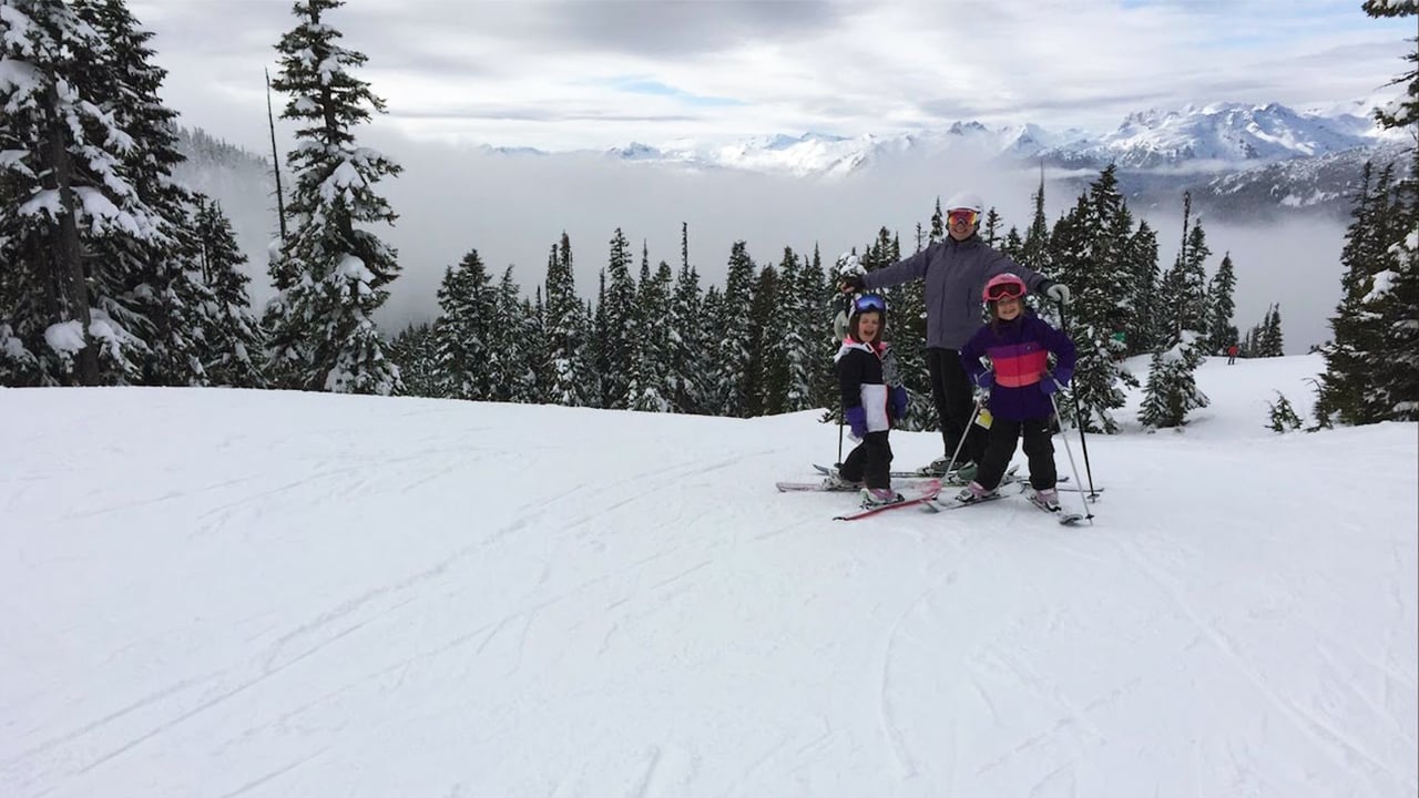 a family skiing on a mountain