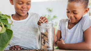 Brother and sister learning about money