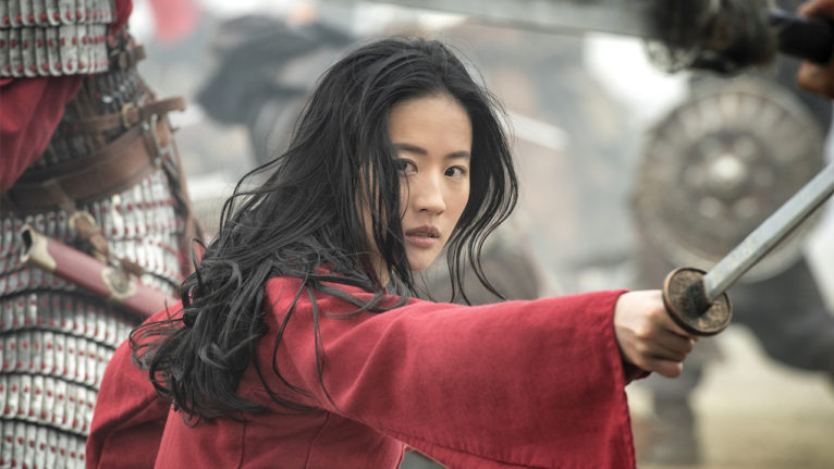 a still from the live action Mulan movie showing Mulan in the middle of a battle