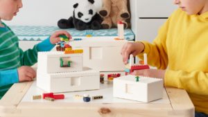 kids playing with lego on a table