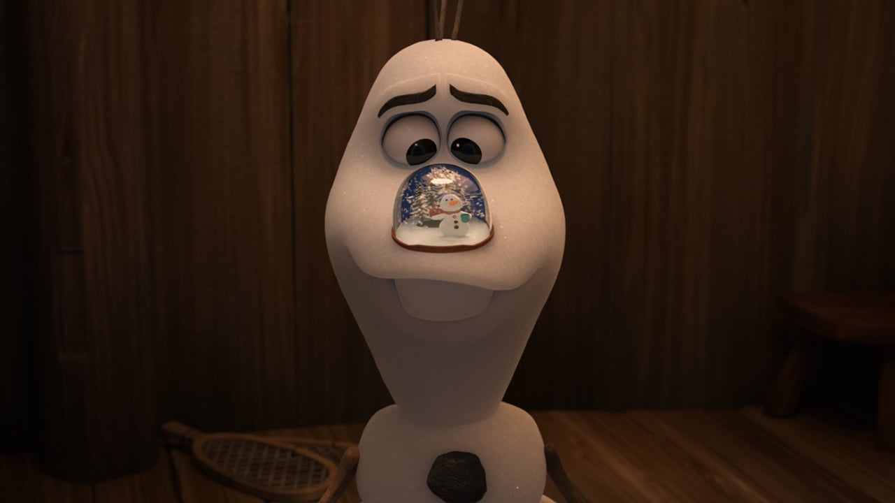 image of Olaf the snowman from Frozen with a snowglobe where his nose should be