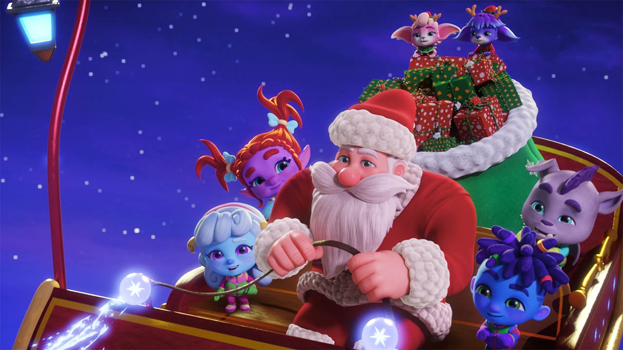 A still from Super Monsters: Santa’s Super Monster Helpers showing the Super monsters sitting in Santa's sleigh while he flies through the night sky
