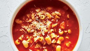 pasta soup with red sauce in a bowl