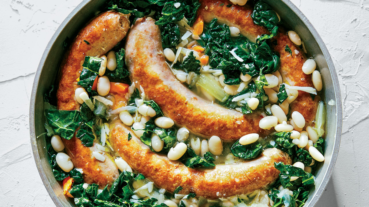 casserole dish with sausage, bean and kale stew