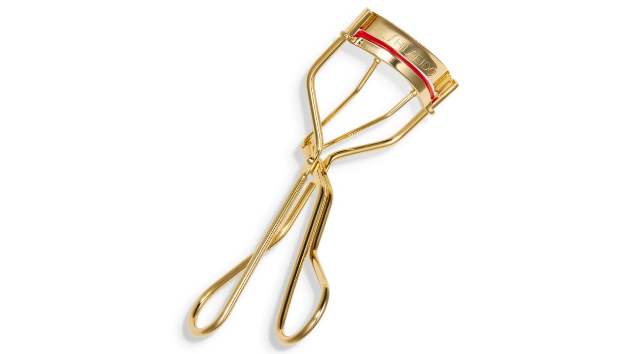 gold eyelash curler with red rubber guard