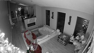 Home security catches Santa delivering gifts