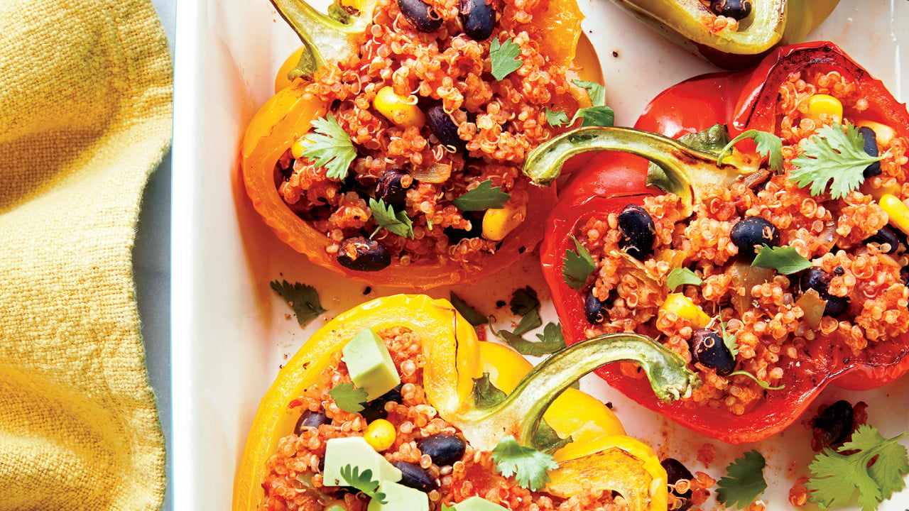 tri-coloured peppers stuffed with quinoa and beans