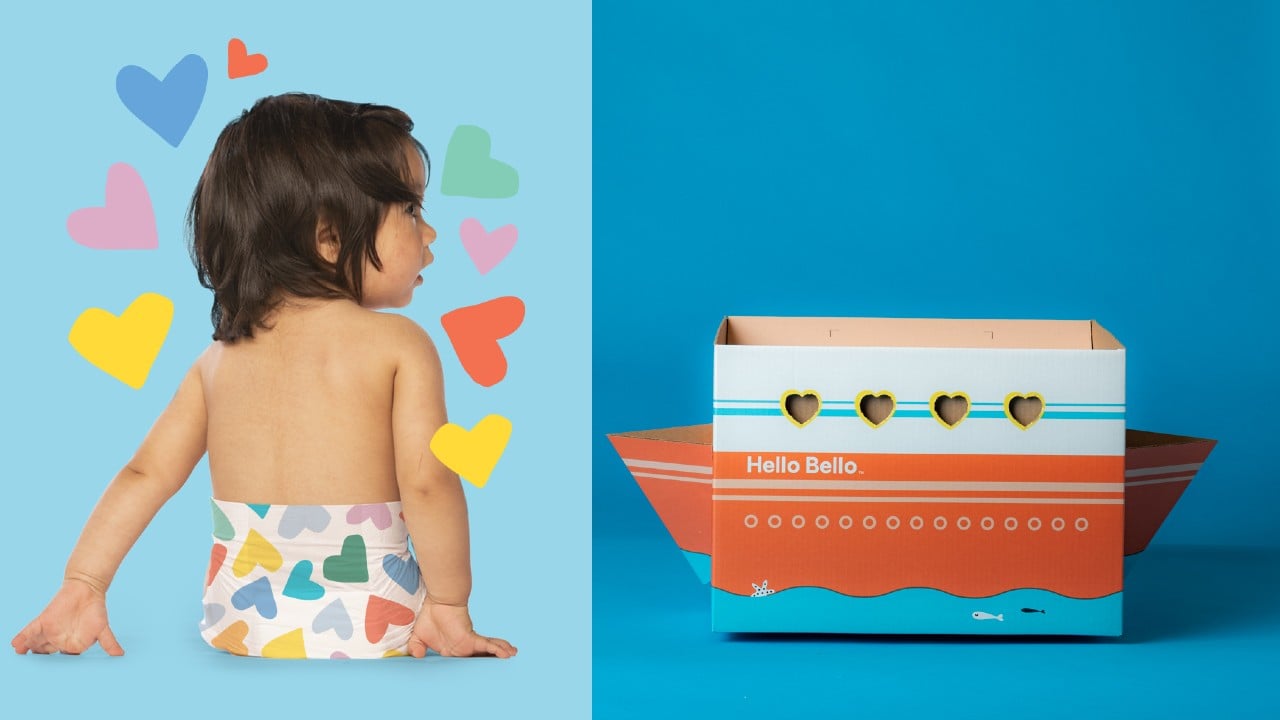 baby in heart print diapers and box shaped like boat with hearts