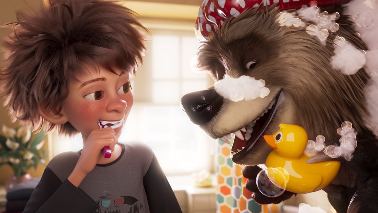 A still from Bigfoot Family showing an animated kid brushing his teeth while an animated bear shows off a rubber ducky while covered in bubble bath suds