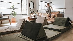 kid jumping on play furniture