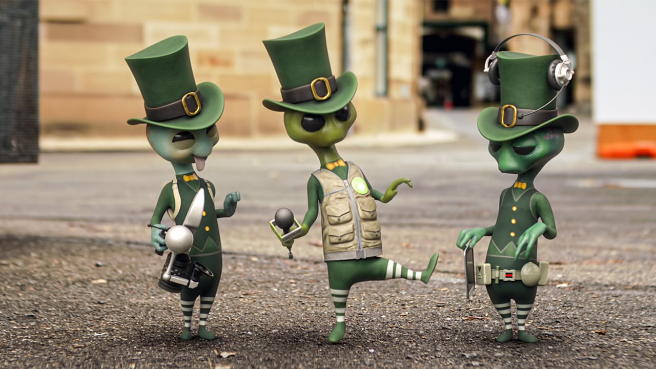 Still from the show Alien TV showing three animated aliens standing on a road wearing green top hats