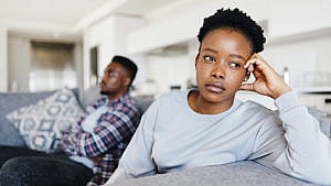a woman looking away from her partner in anger