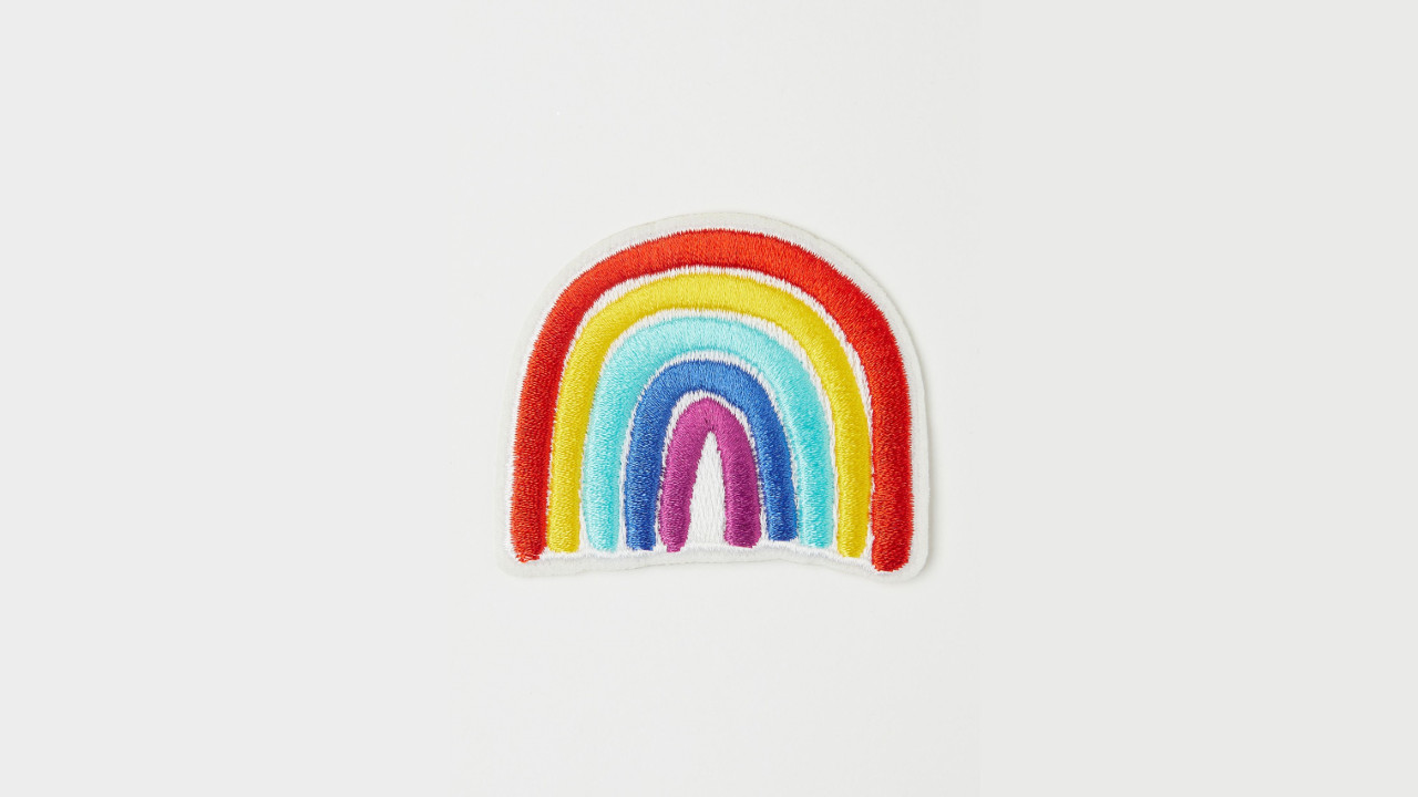 A repair patch for clothing in the shape of a rainbow from H&M