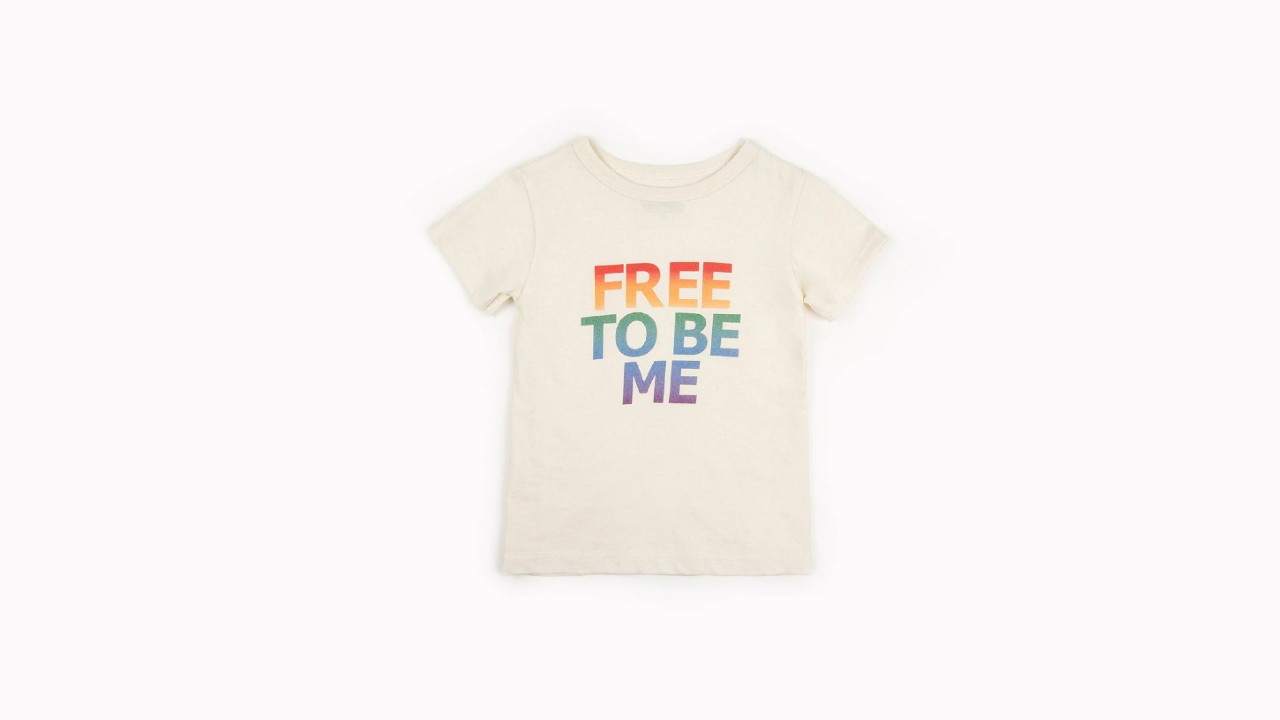 A kids' pride shirt with 'free to be me' on it by Mini Mioche