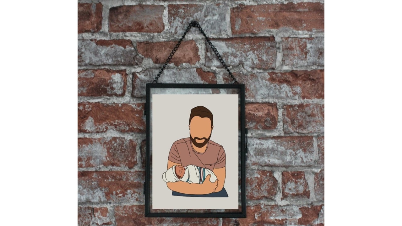 Framed illustration of a father carrying a baby