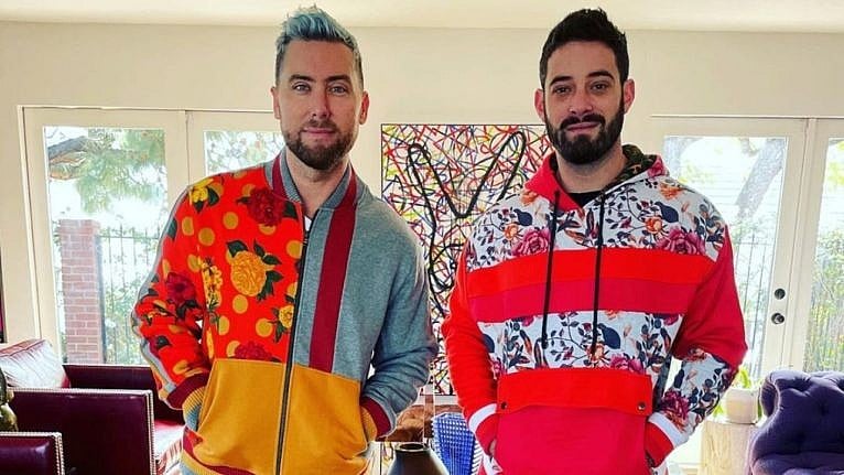 Lance Bass and his husband in vibrant sweatsuits