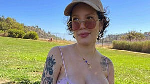 the singer halsey nurses their two-week-old baby outside in a field