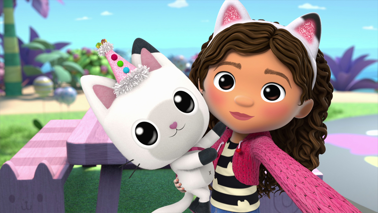 still from Gabby's dollhouse showing an animated kid vlogging with her pet cat
