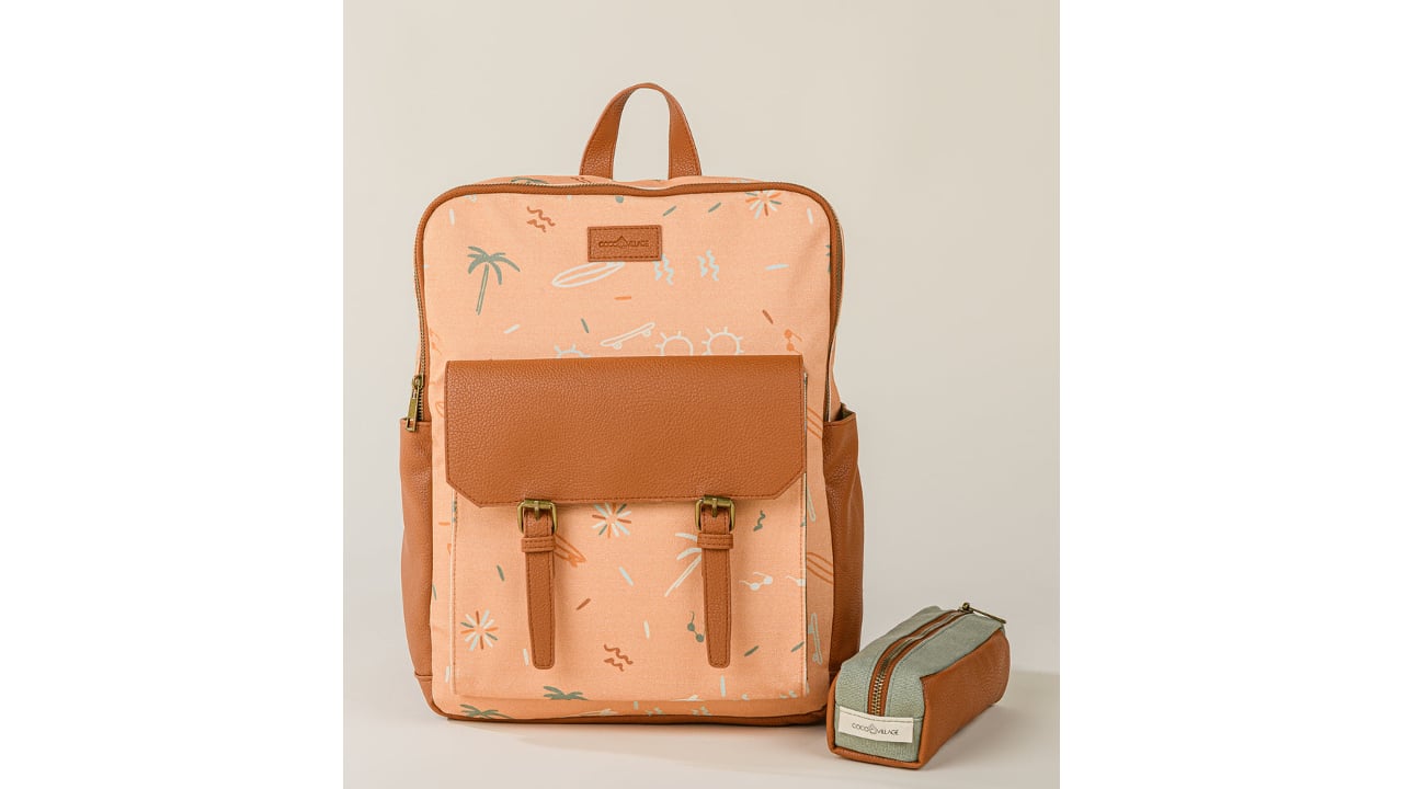 Light orange backpack with palm tree design and brown leather accents