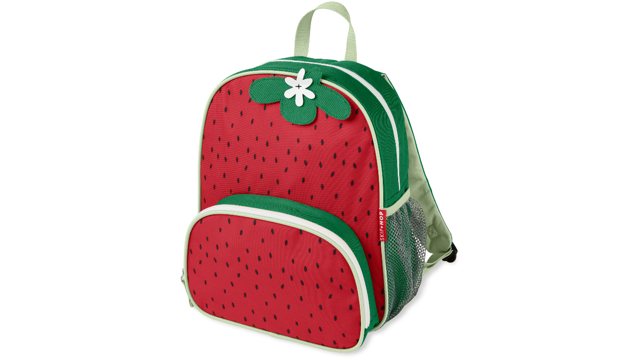 Red backpack with black seeds and green and white accents