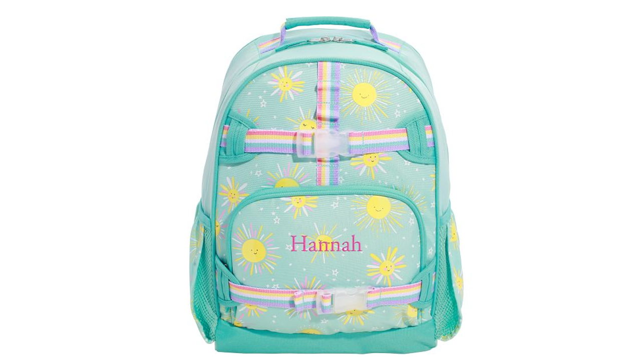 Light green backpack with yellow smiling suns and rainbow buckles