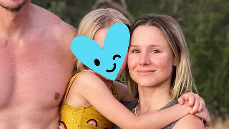 Kristen Bell and her daughter posing with a heart over her daughter's face