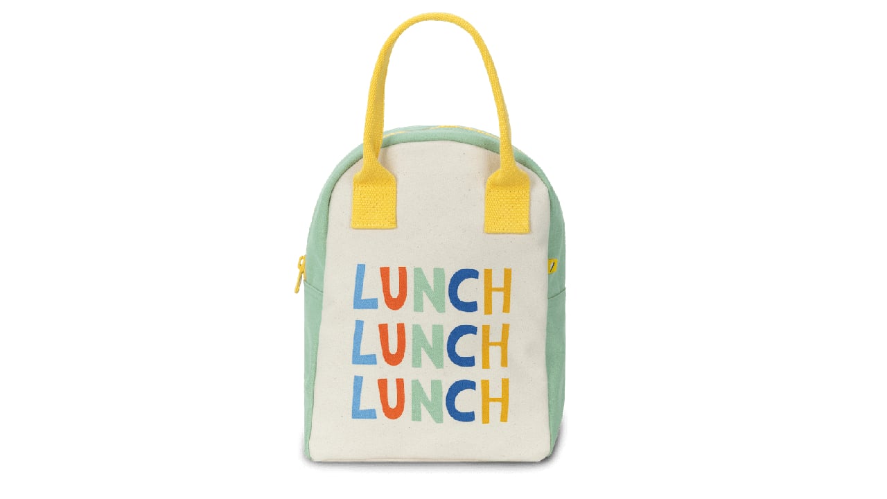 Cream lunch bag that says "Lunch" three times with green and yellow accents