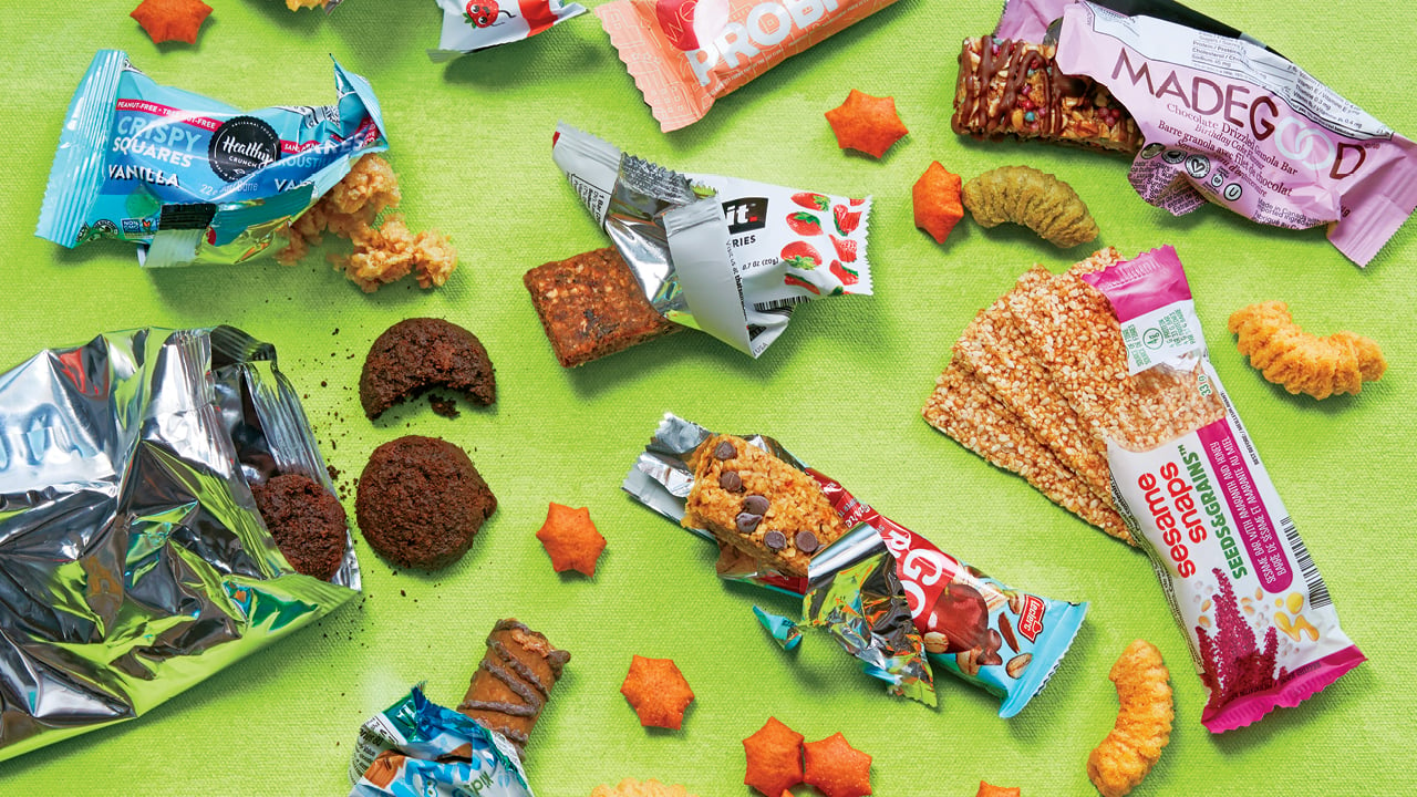 Photo of opened snacks on a green background