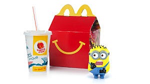 photo of a happy meal box and drink with a plastic minion toy looking shocked