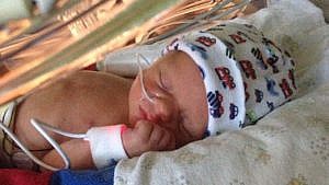 Photo of newborn in NICU.