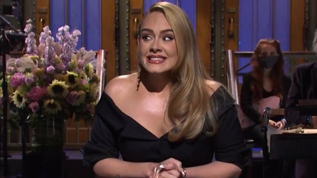 Photo of Adele nervously smiling while doing her monologue on Saturday Night Live