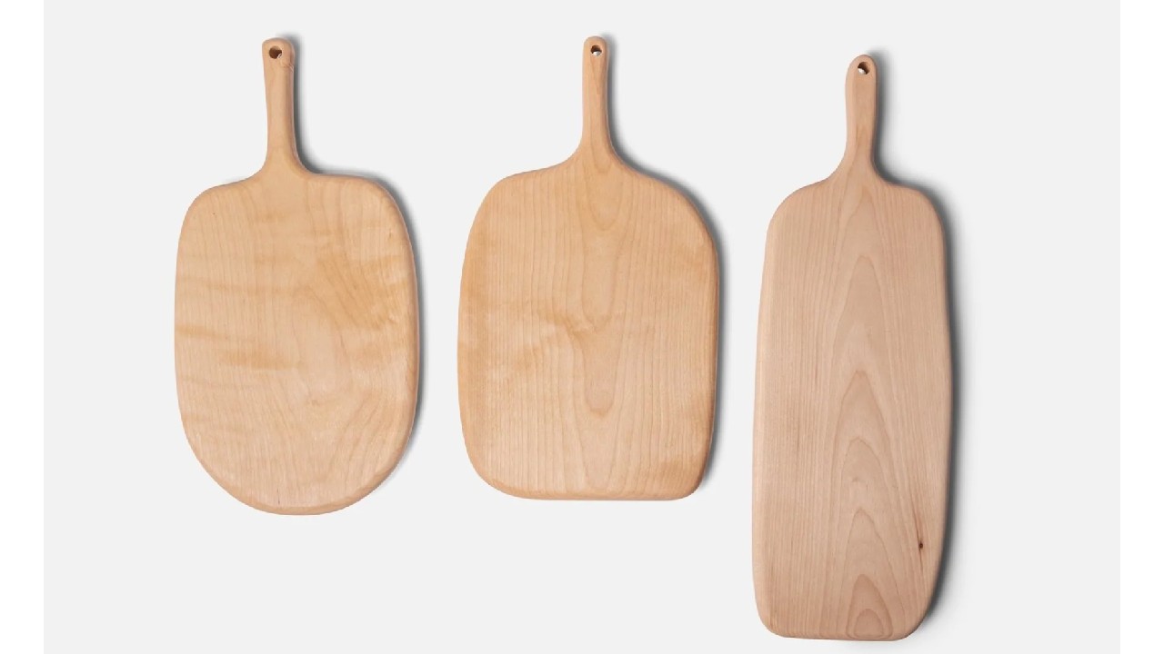 three organic-shaped wooden boards