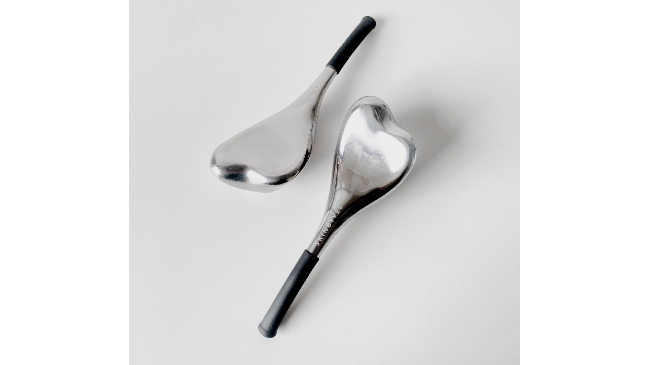 silver cryo gua sha sticks with narrow black handles