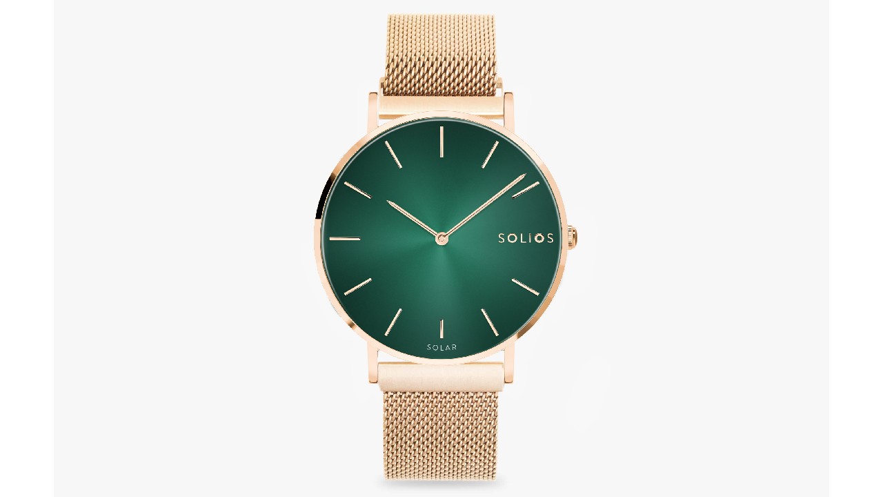 gold-toned mesh watch with emerald green watch face