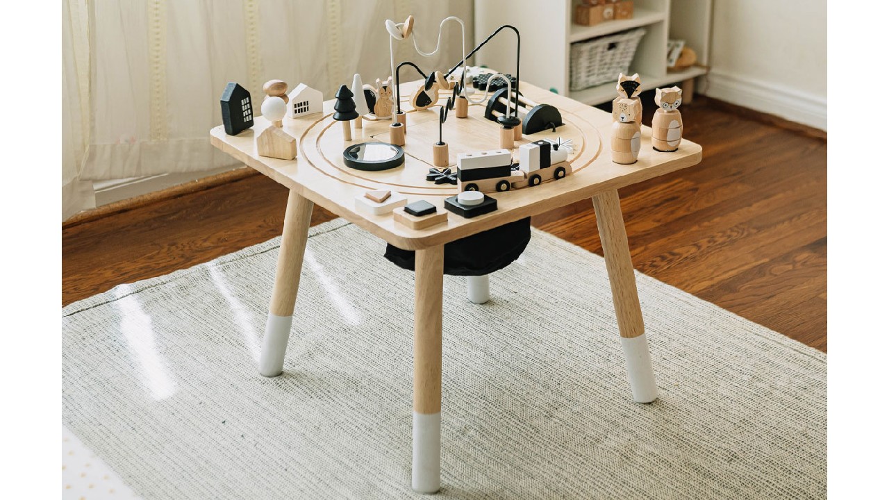 wooden activity table in stylized room