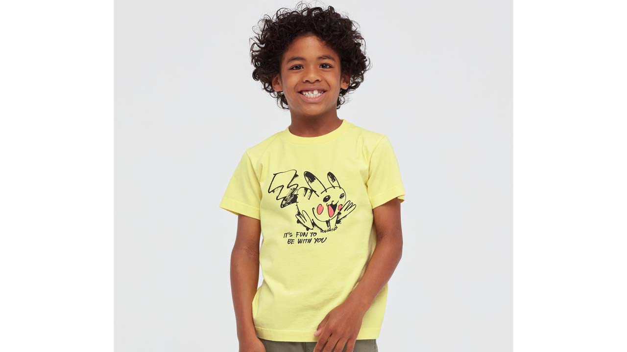 An image of a child wearing a yellow t-shirt with a Pokemon on it.