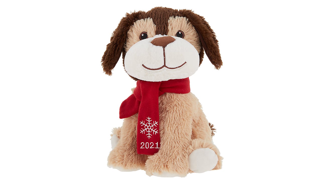 Brown plush dog wearing red scarf